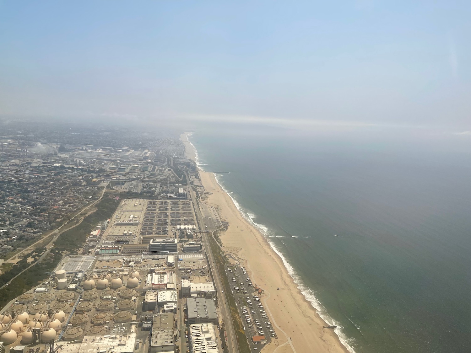 a aerial view of a beach and a city