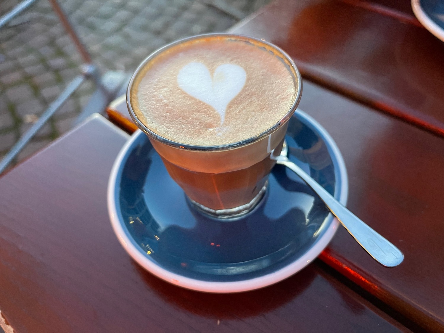 a cup of coffee with a heart in the foam