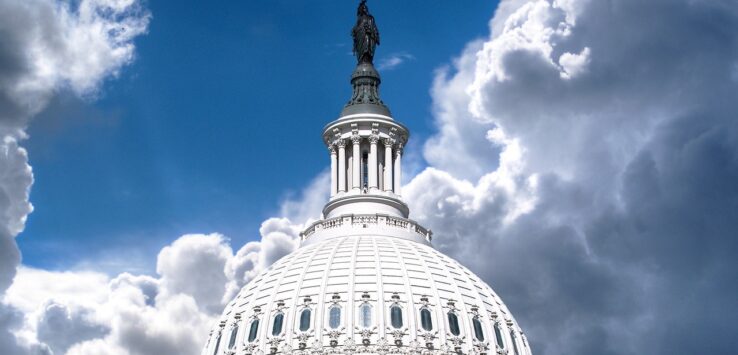 a white dome with a statue on top