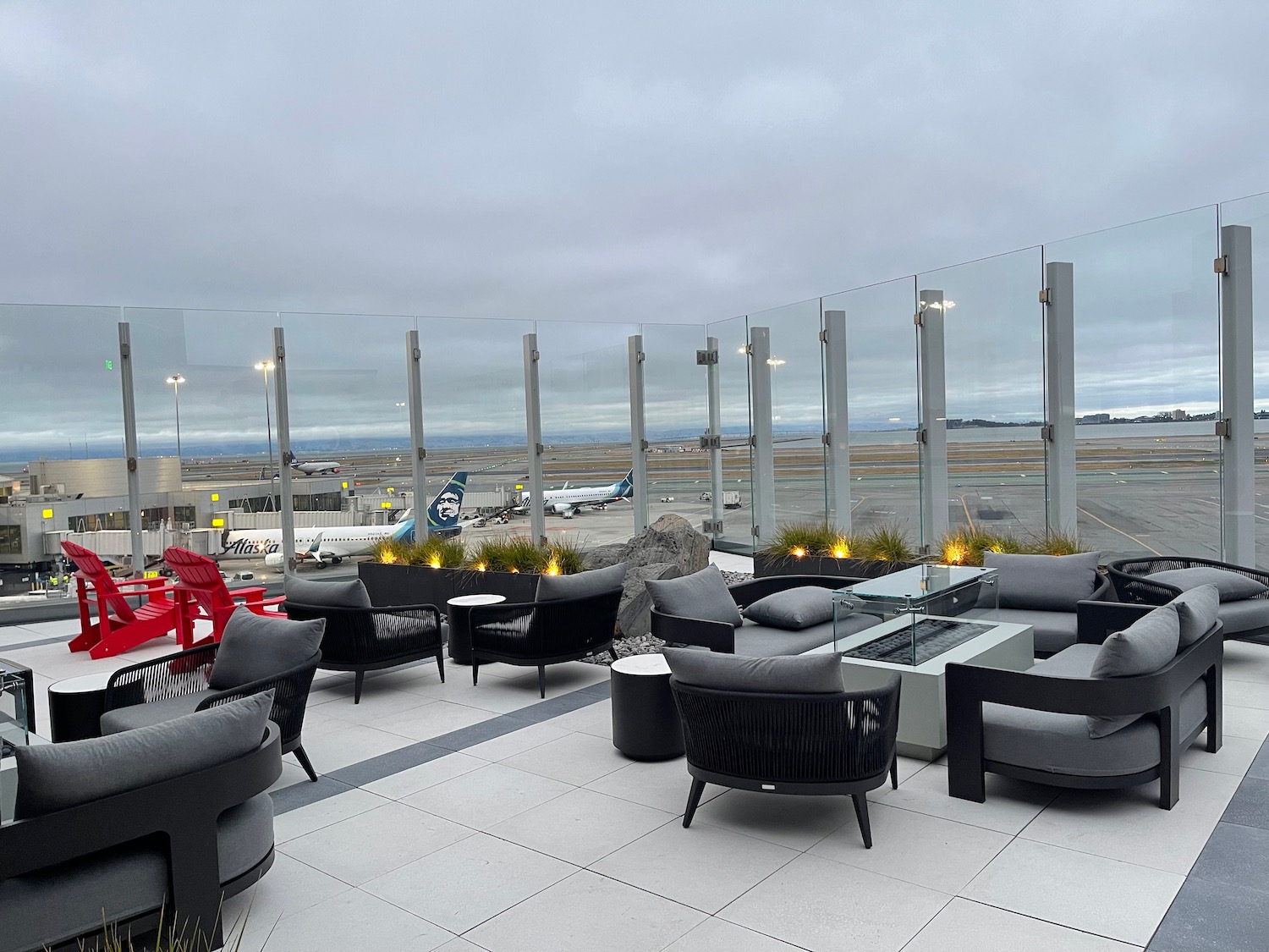 a lounge area with chairs and tables