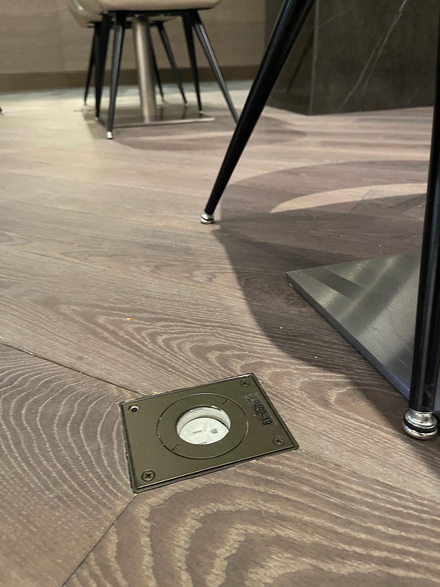 a metal square on a wood floor