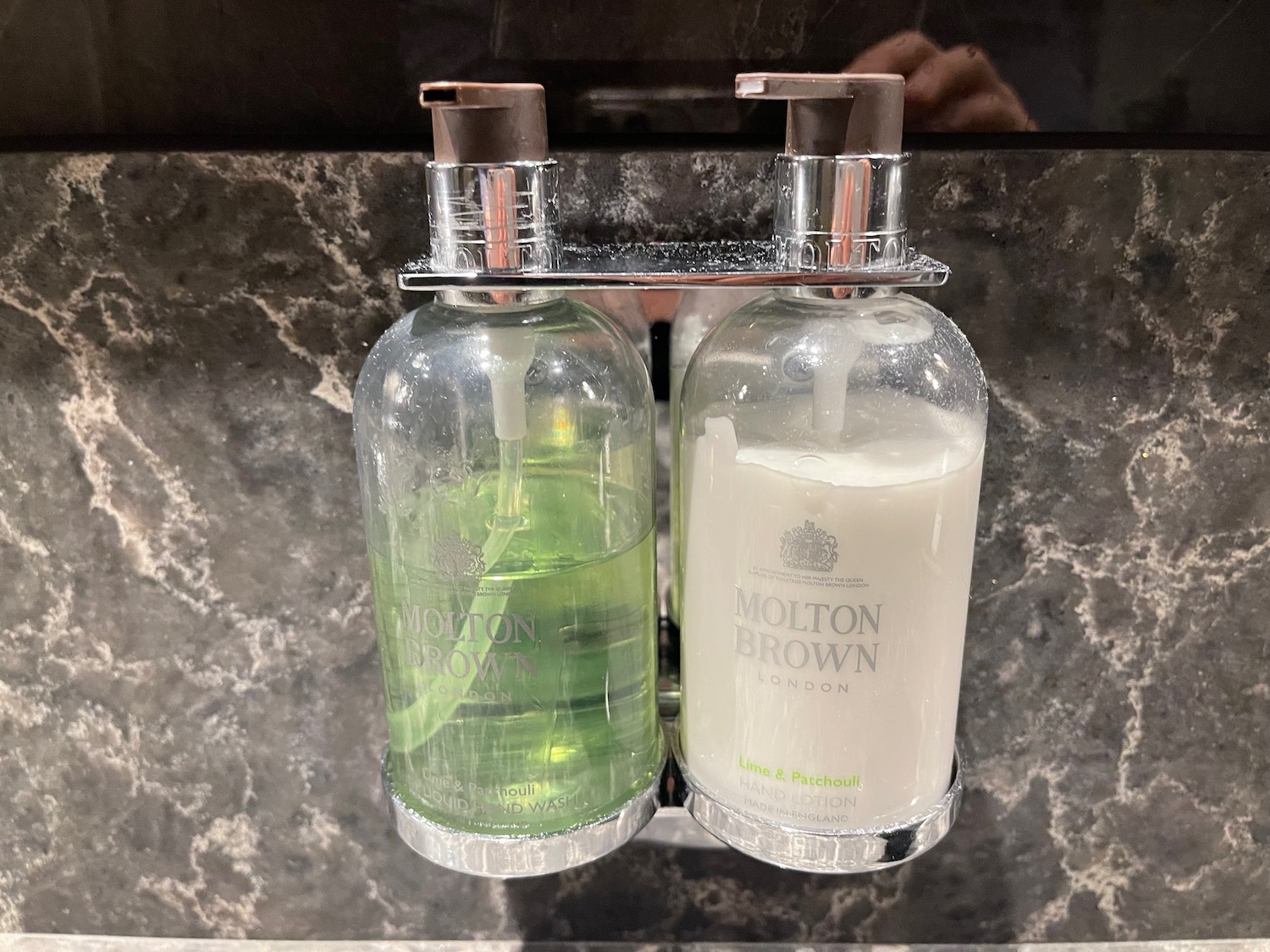 a couple of soap dispensers on a counter