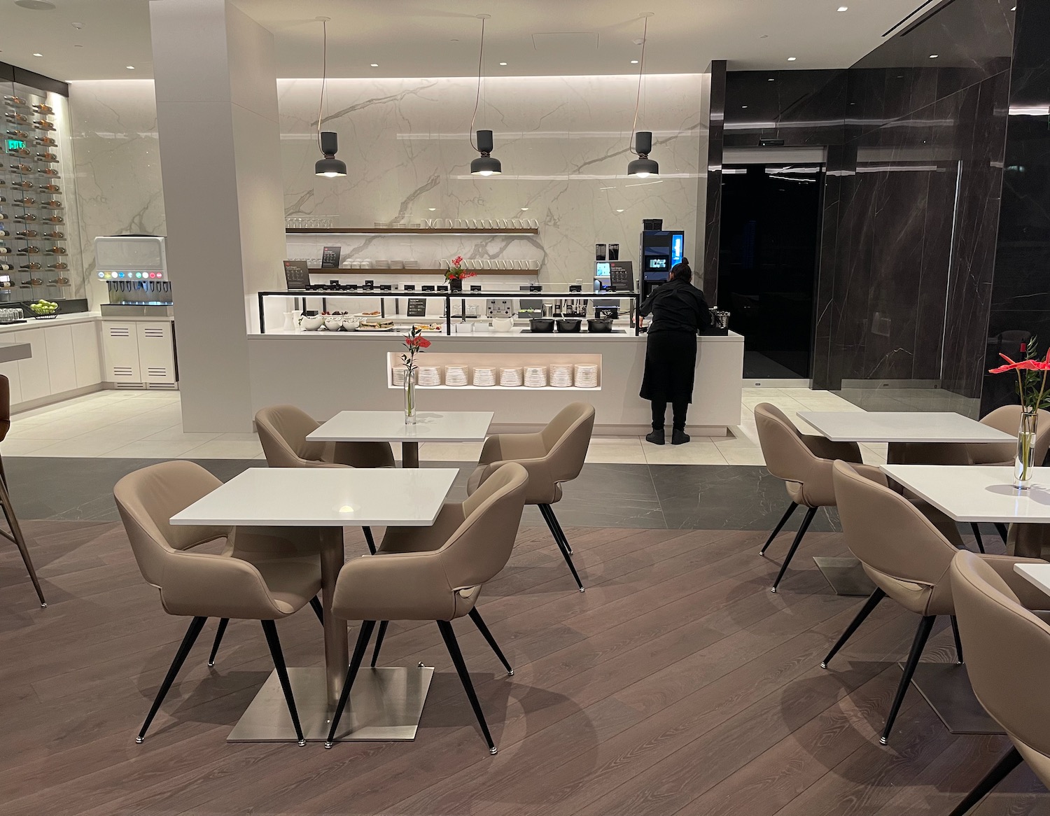 a restaurant with white tables and chairs