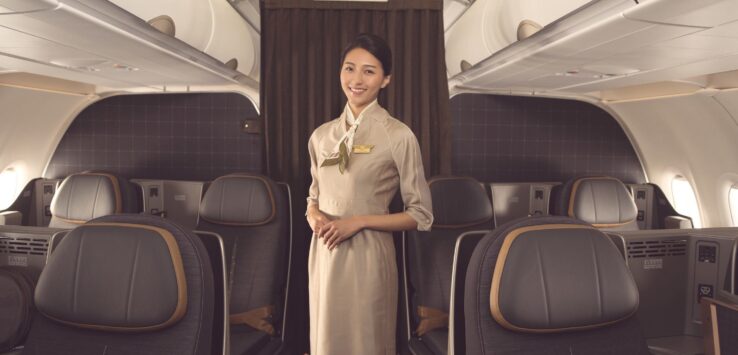 a woman standing in an airplane