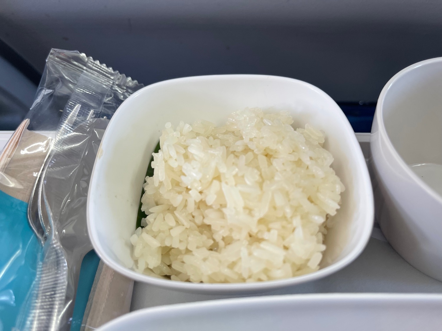 a bowl of rice in a plastic container