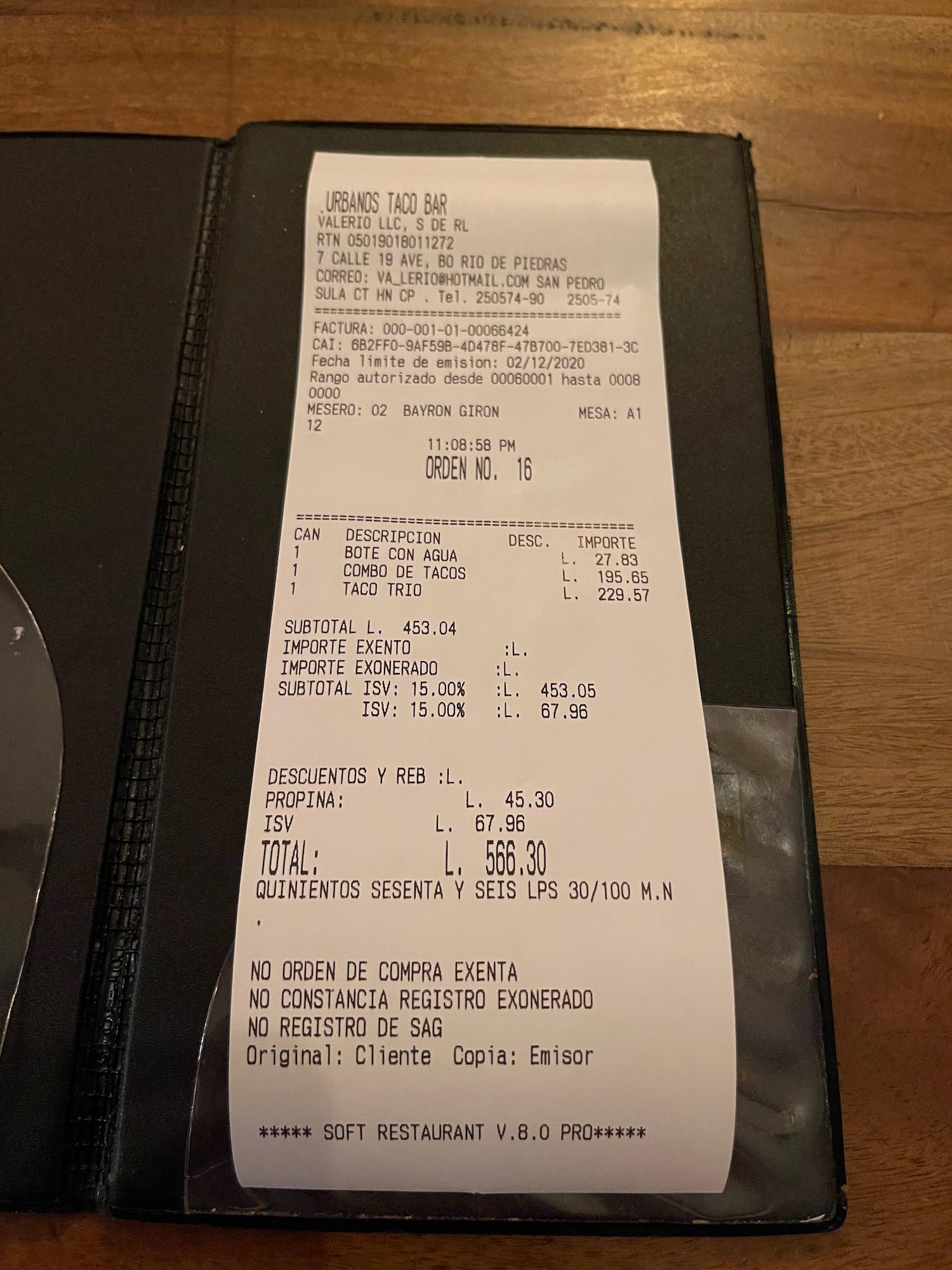 a receipt on a restaurant table