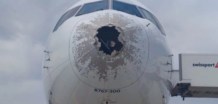 the front of an airplane with a hole in it