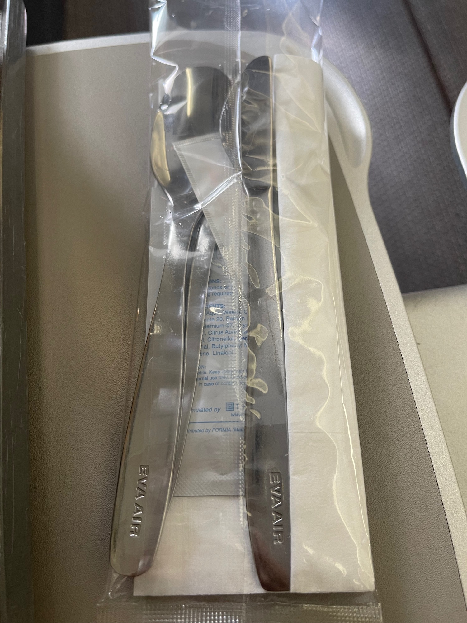 a spoon and fork in a plastic wrap