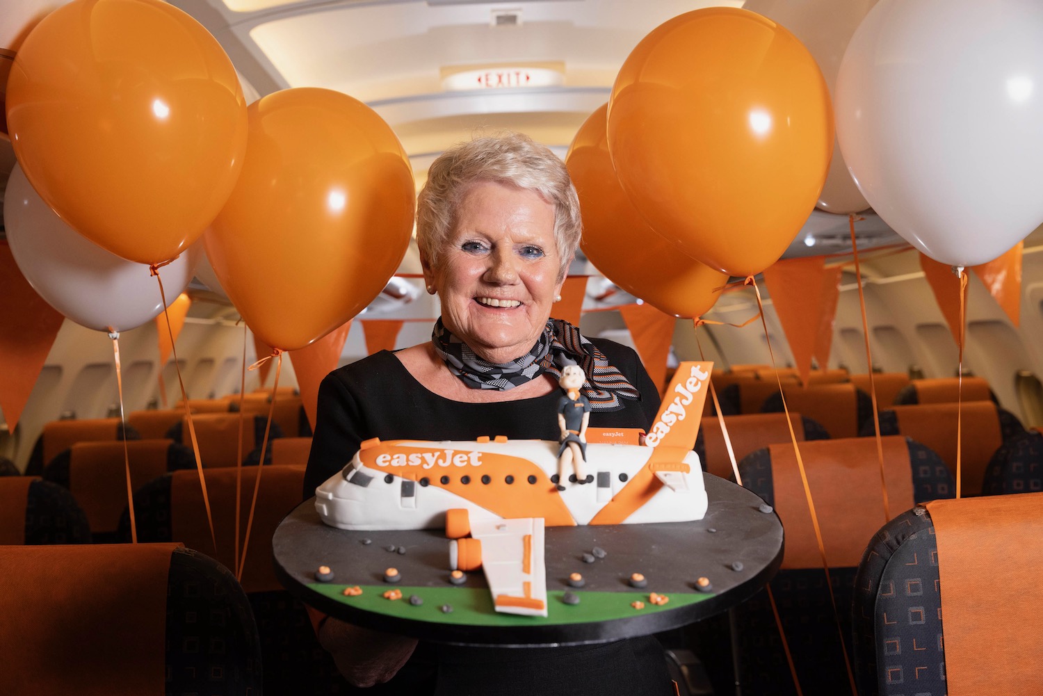 a woman holding a cake