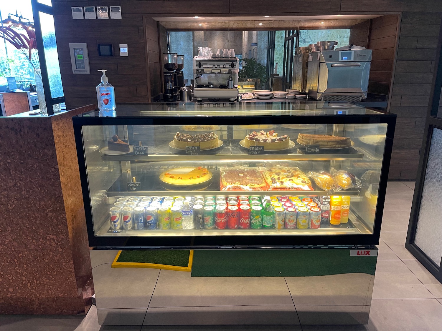 a glass display case with food on it