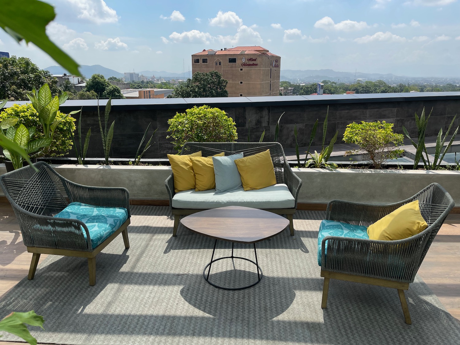 a patio with chairs and a table