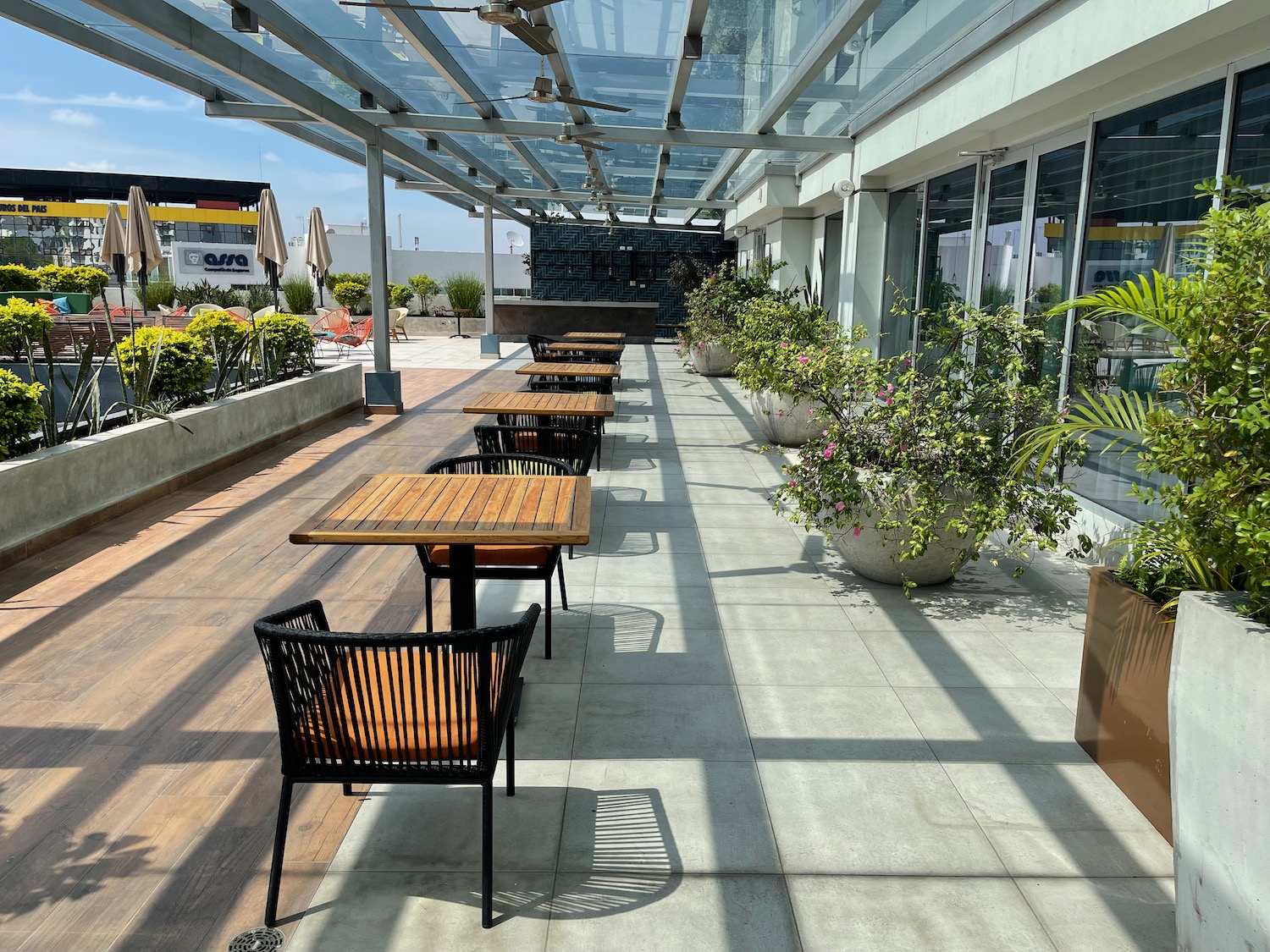 a patio with tables and chairs