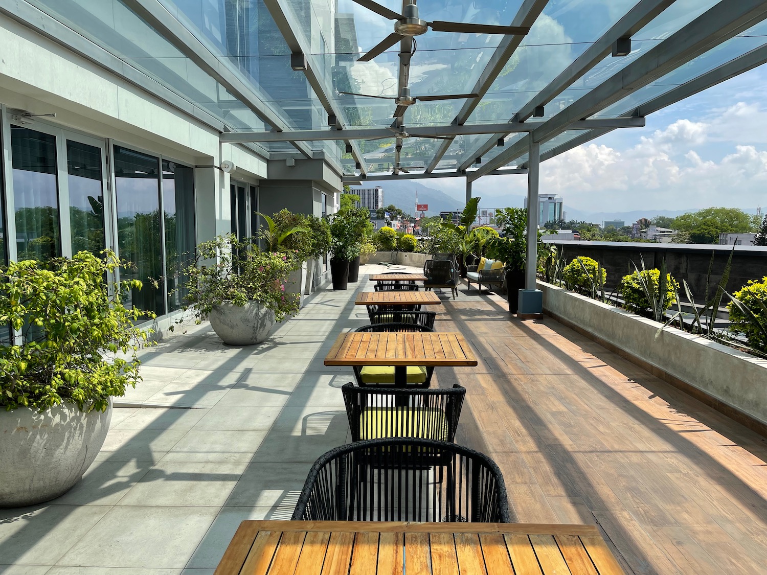 a patio with tables and chairs