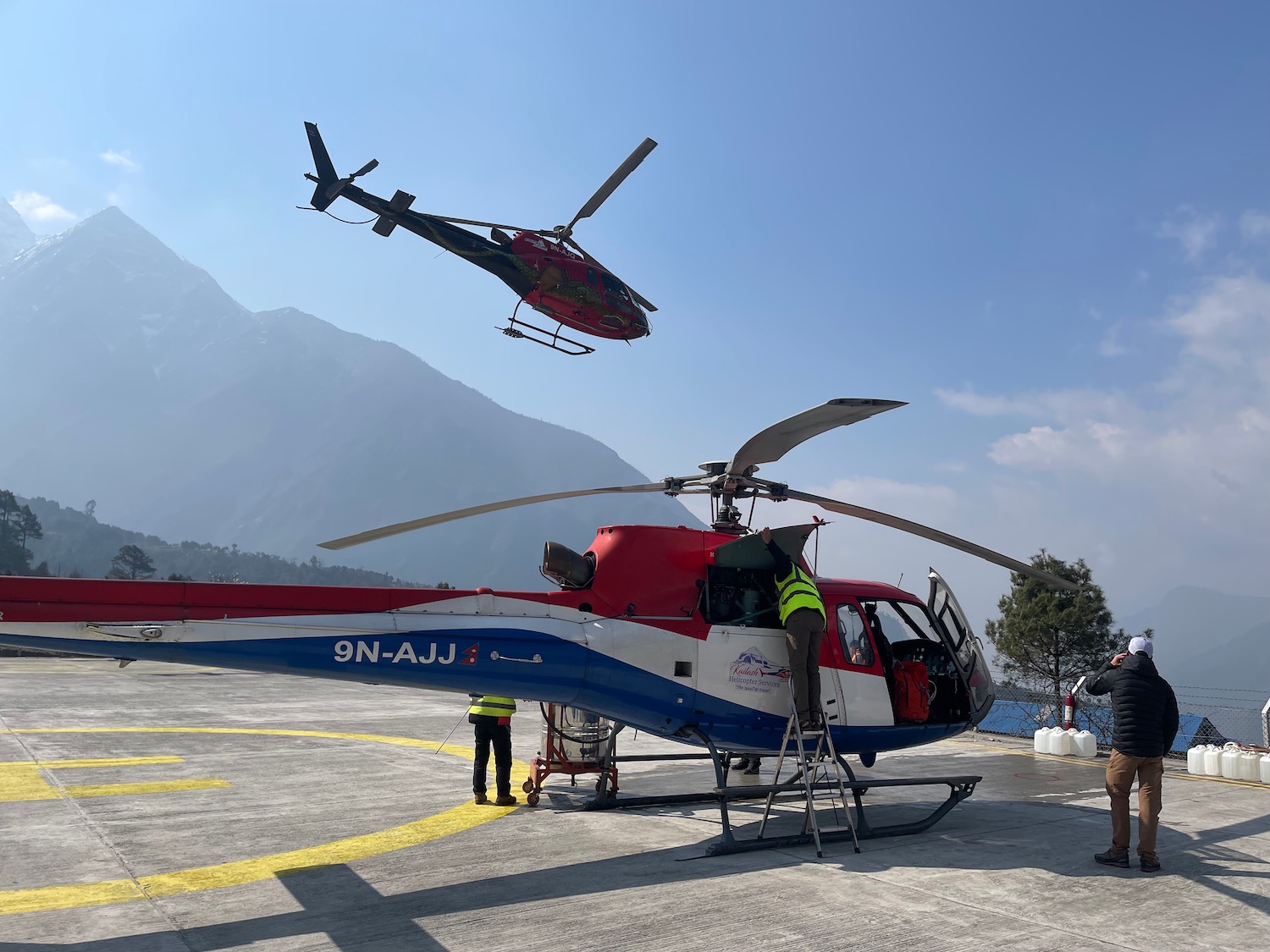 a helicopter flying over a body of water