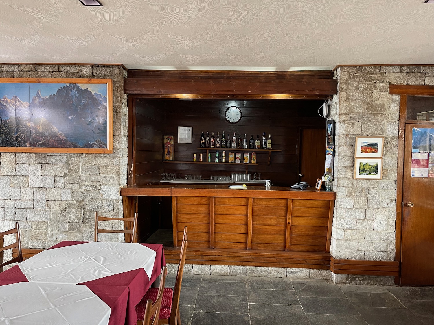 a bar with a table and chairs