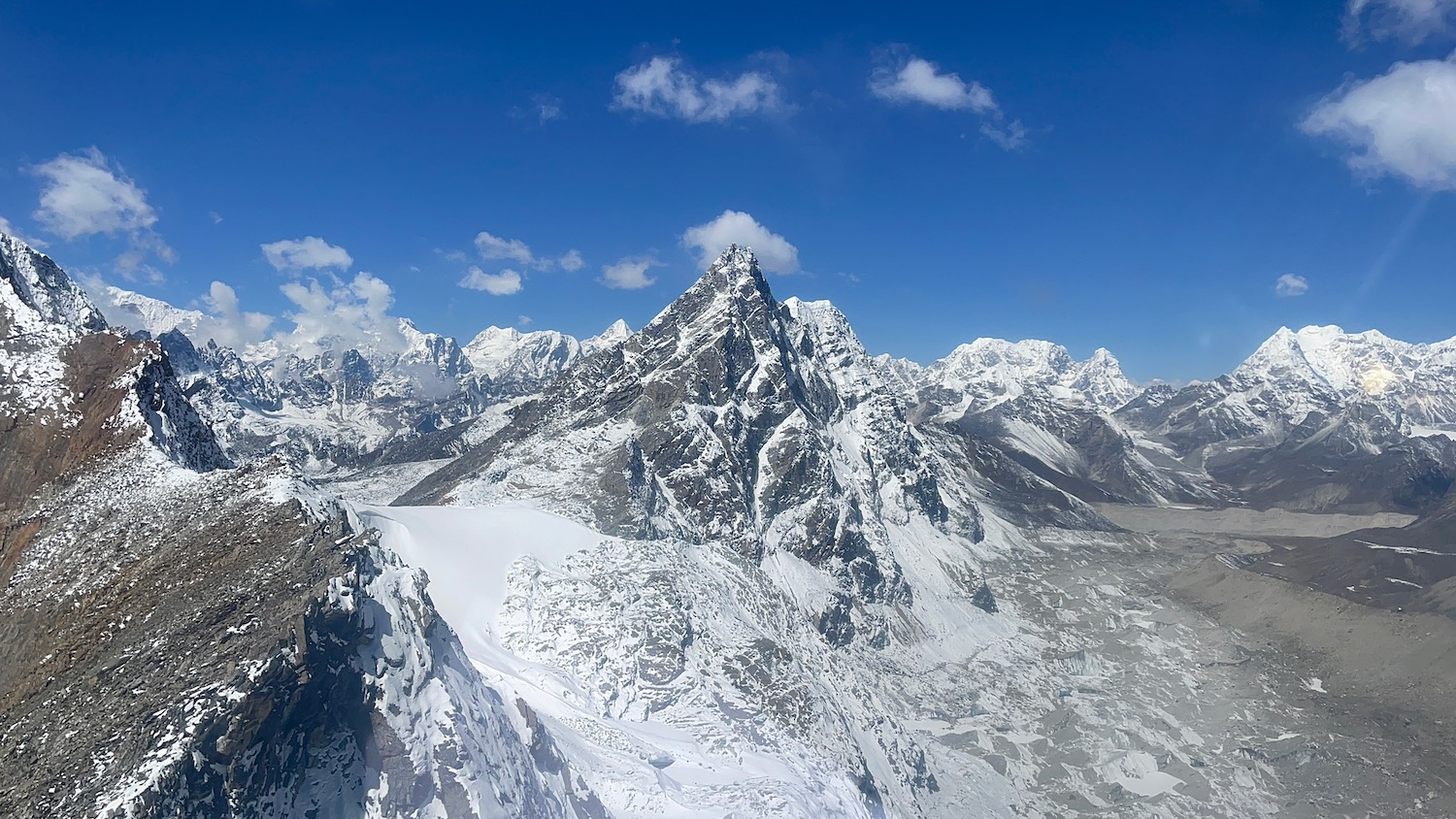 a snowy mountain tops with blue sky