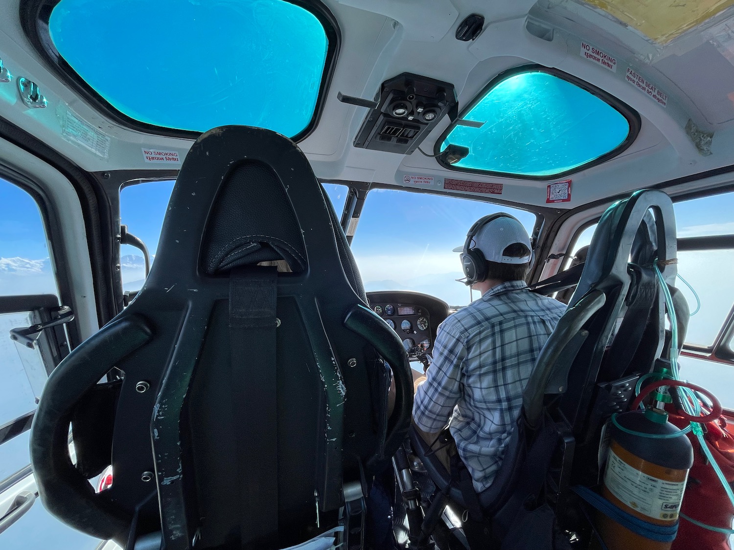 a man in a helicopter cockpit