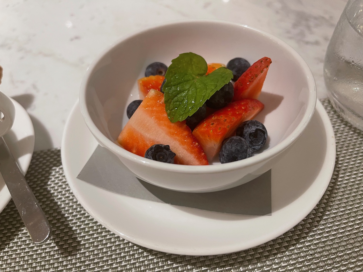 a bowl of fruit on a plate