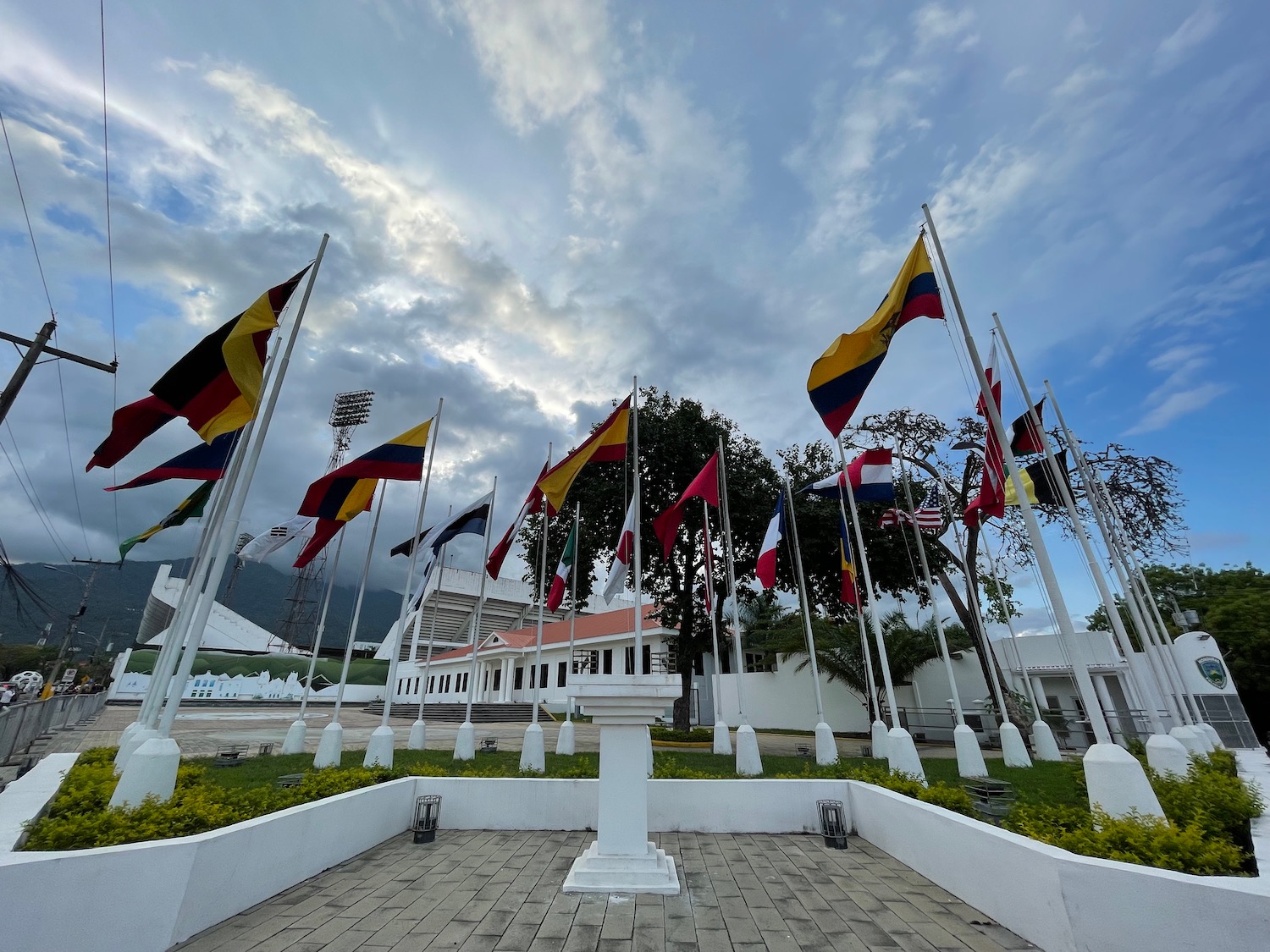 a group of flags on poles