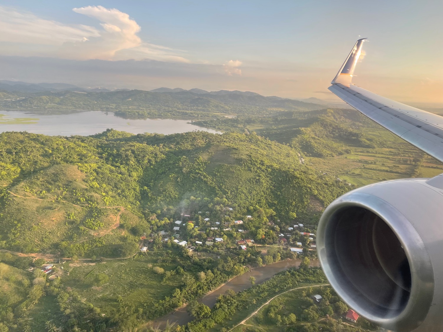 an airplane wing and a landscape