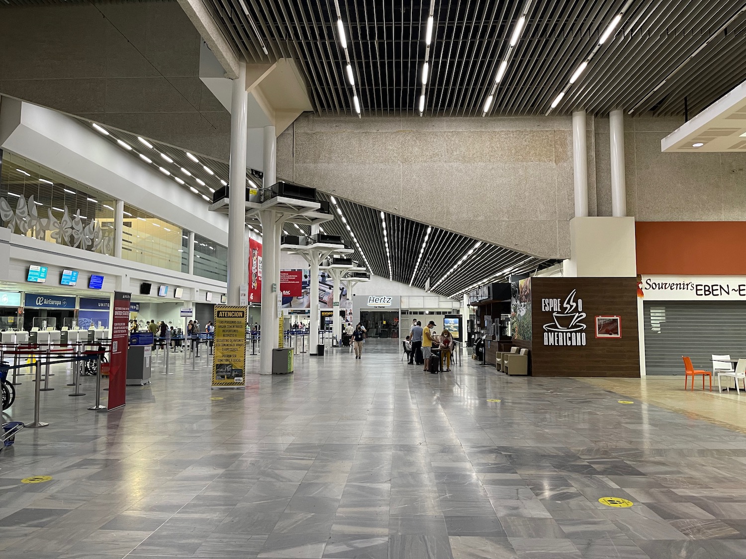 people walking in a large airport