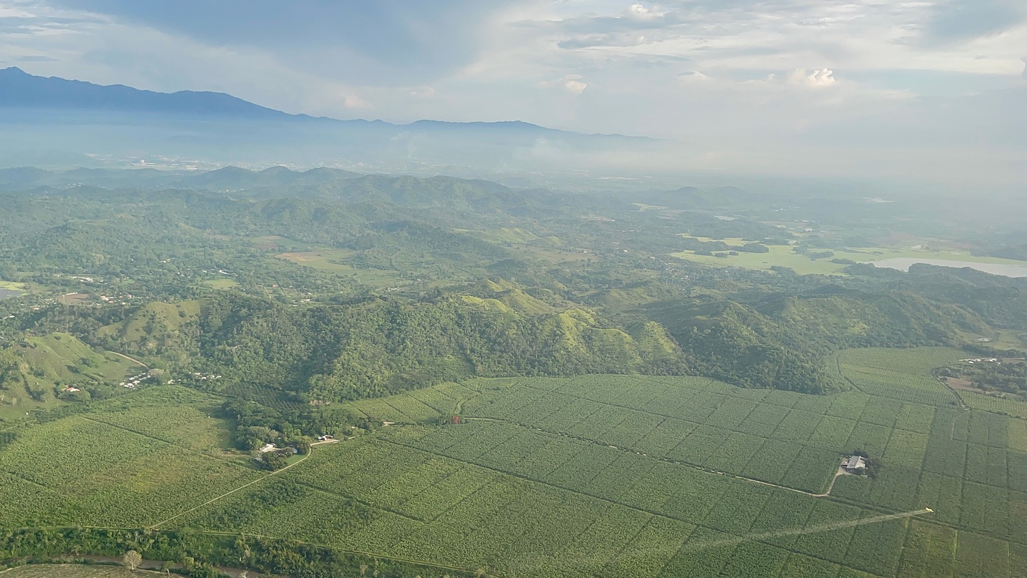 a aerial view of a green valley
