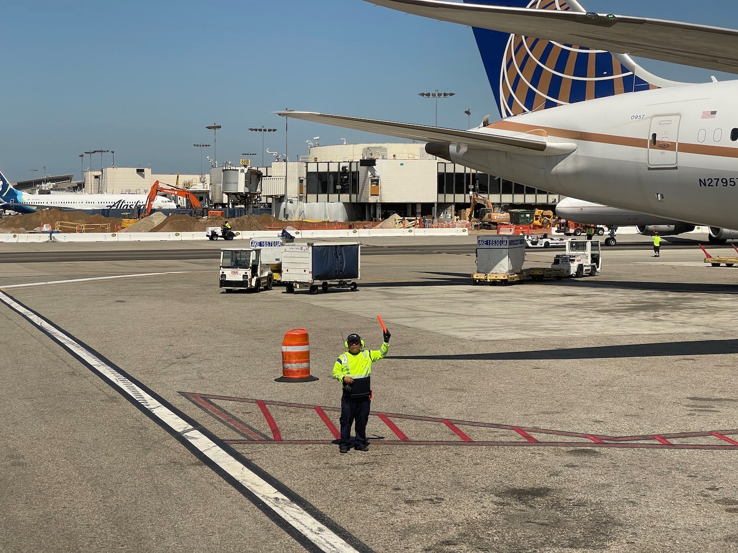 a man standing in front of an airplane