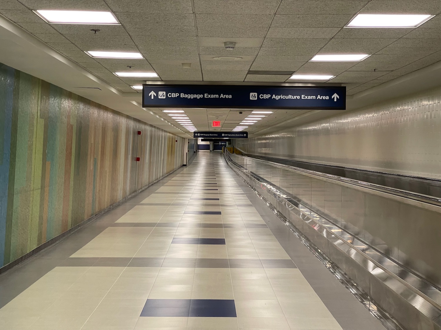 a walkway with an escalator