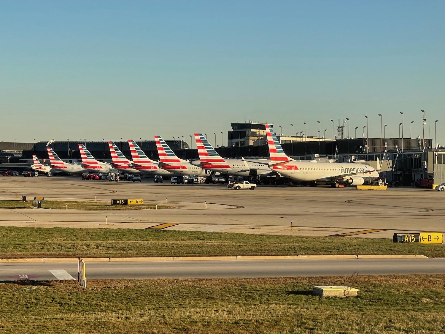 a group of airplanes parked on a runway