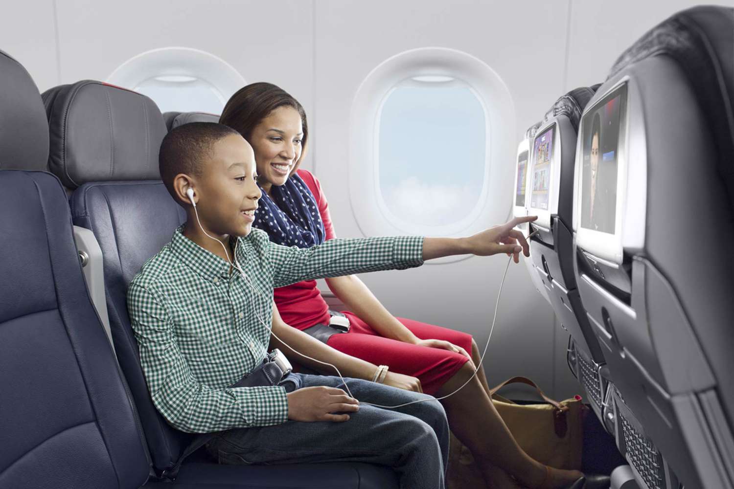 a woman pointing at a child's screen