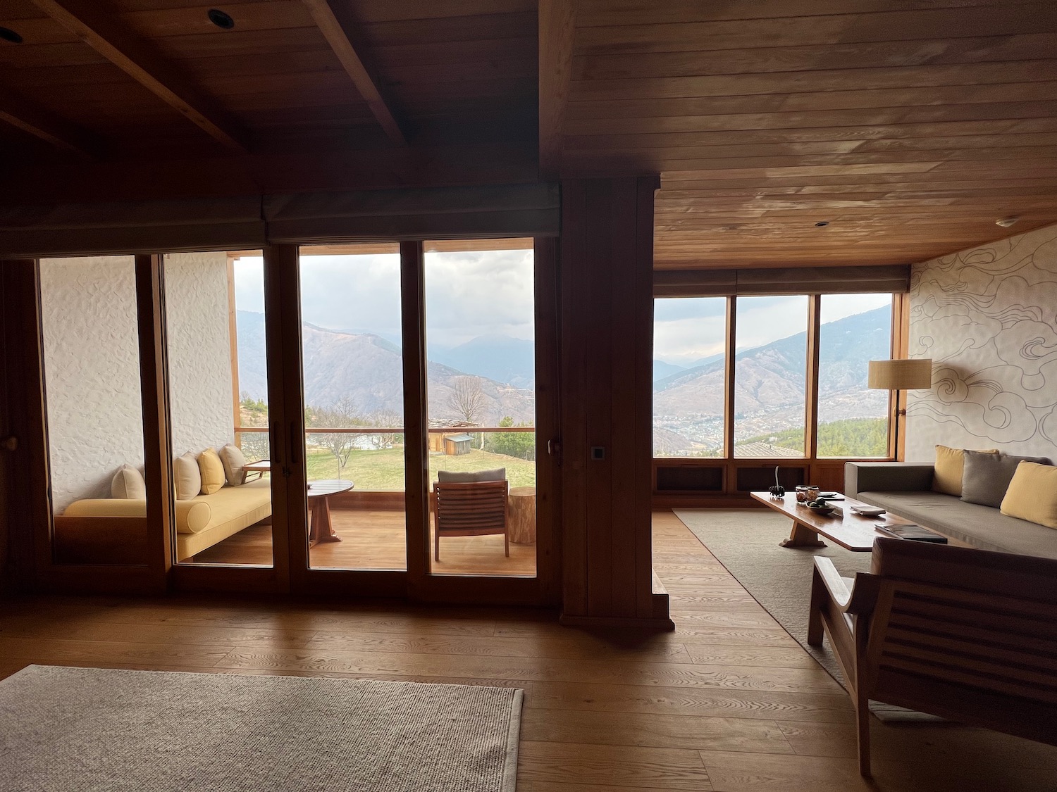 a room with a view of mountains and a couch