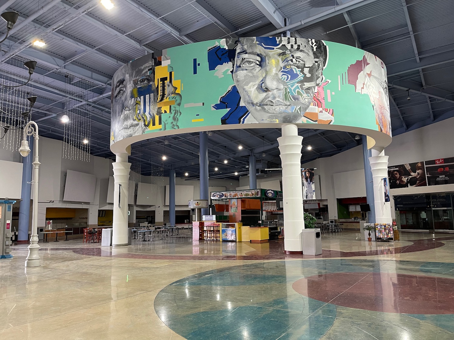 a large room with a large mural on the ceiling