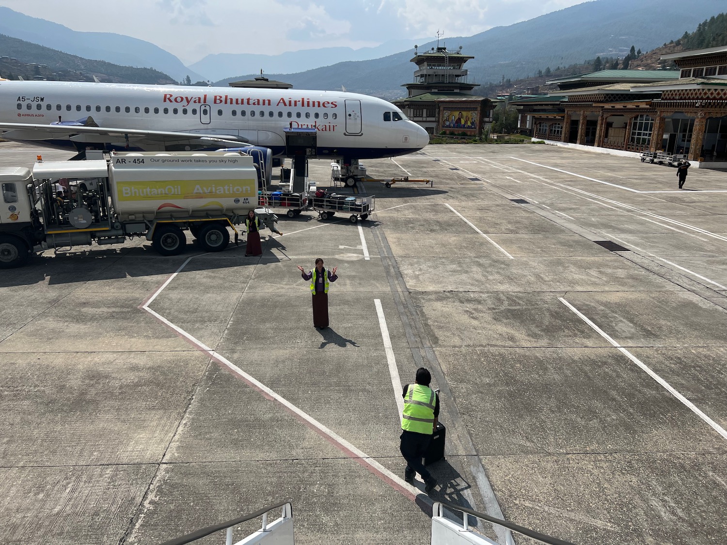 a man standing in front of a plane