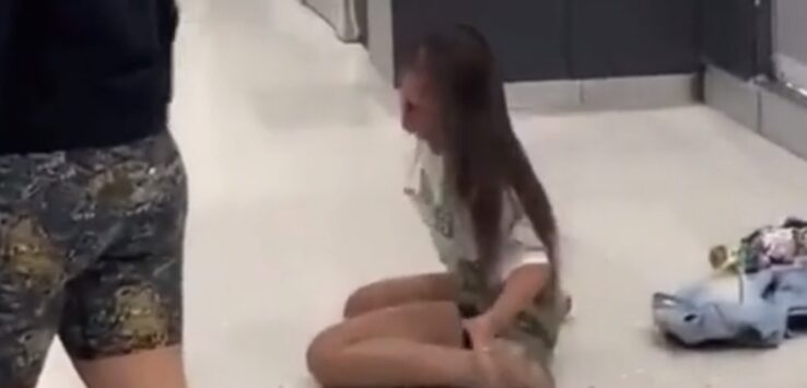 a girl sitting on the floor