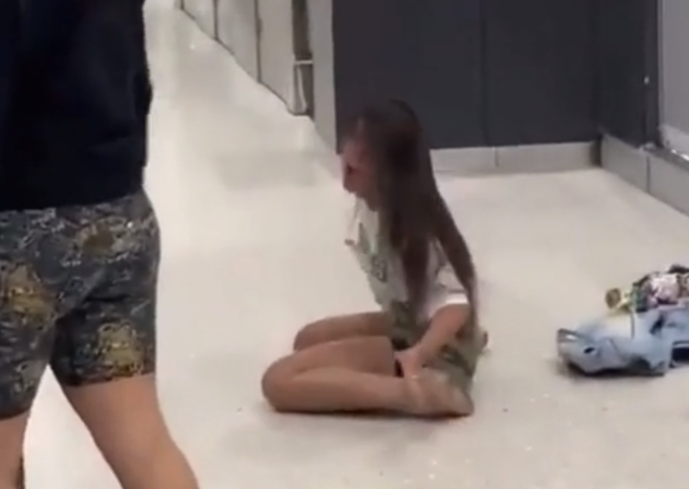 a girl sitting on the floor