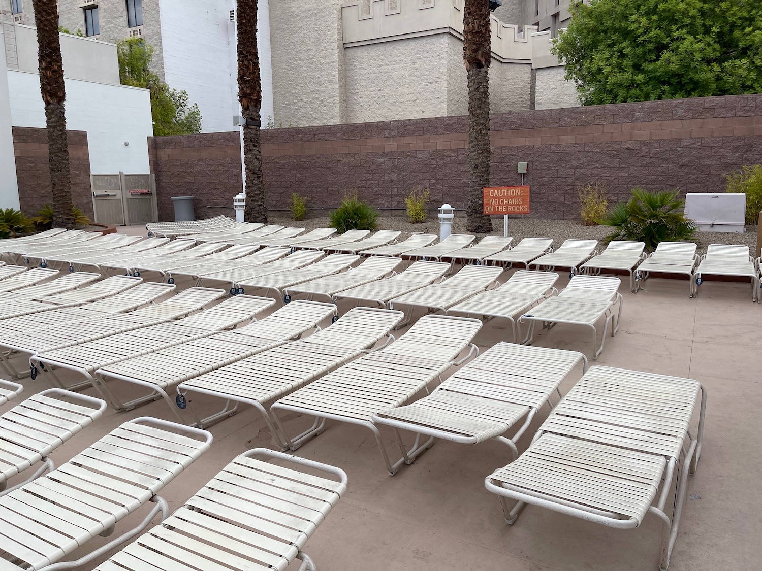 a group of lounge chairs on a patio
