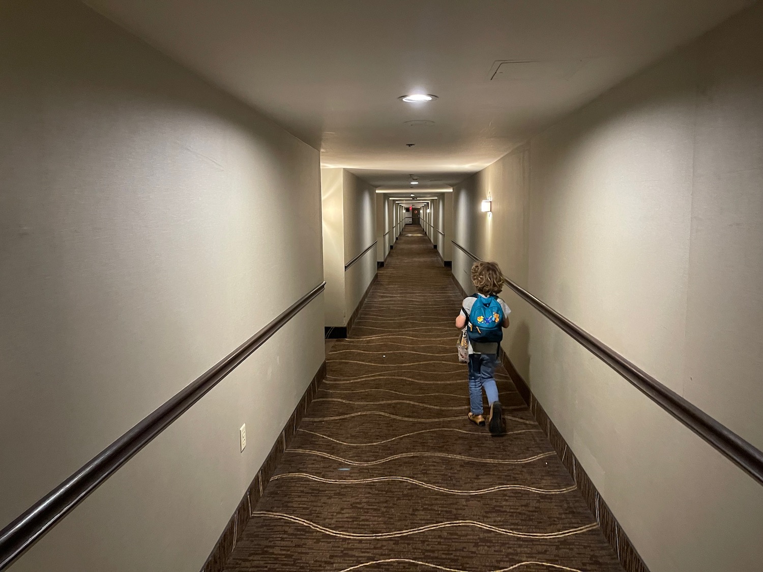 a child walking down a hallway