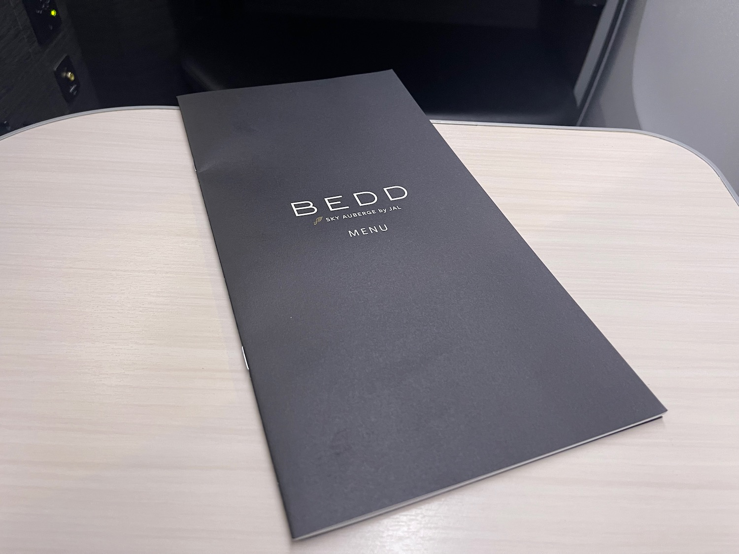 a black menu on a table