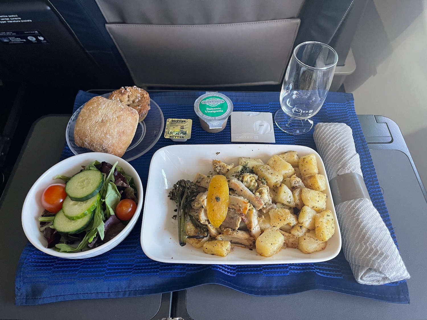 a plate of food and a salad on a table