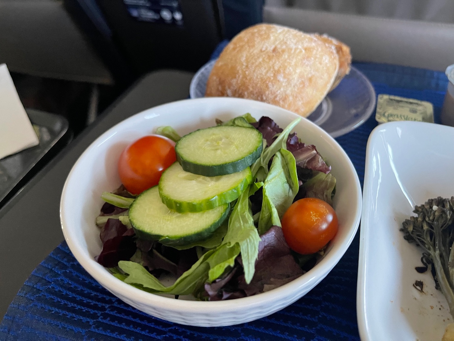 a bowl of salad and a bread