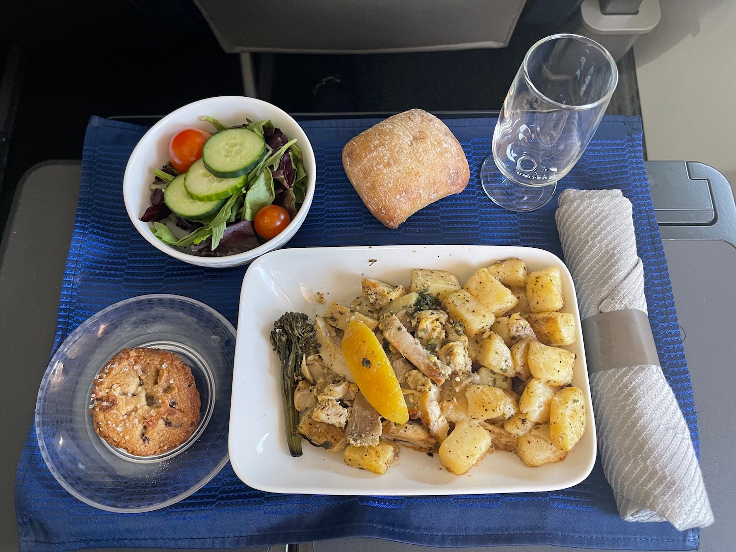 a plate of food and a salad on a table