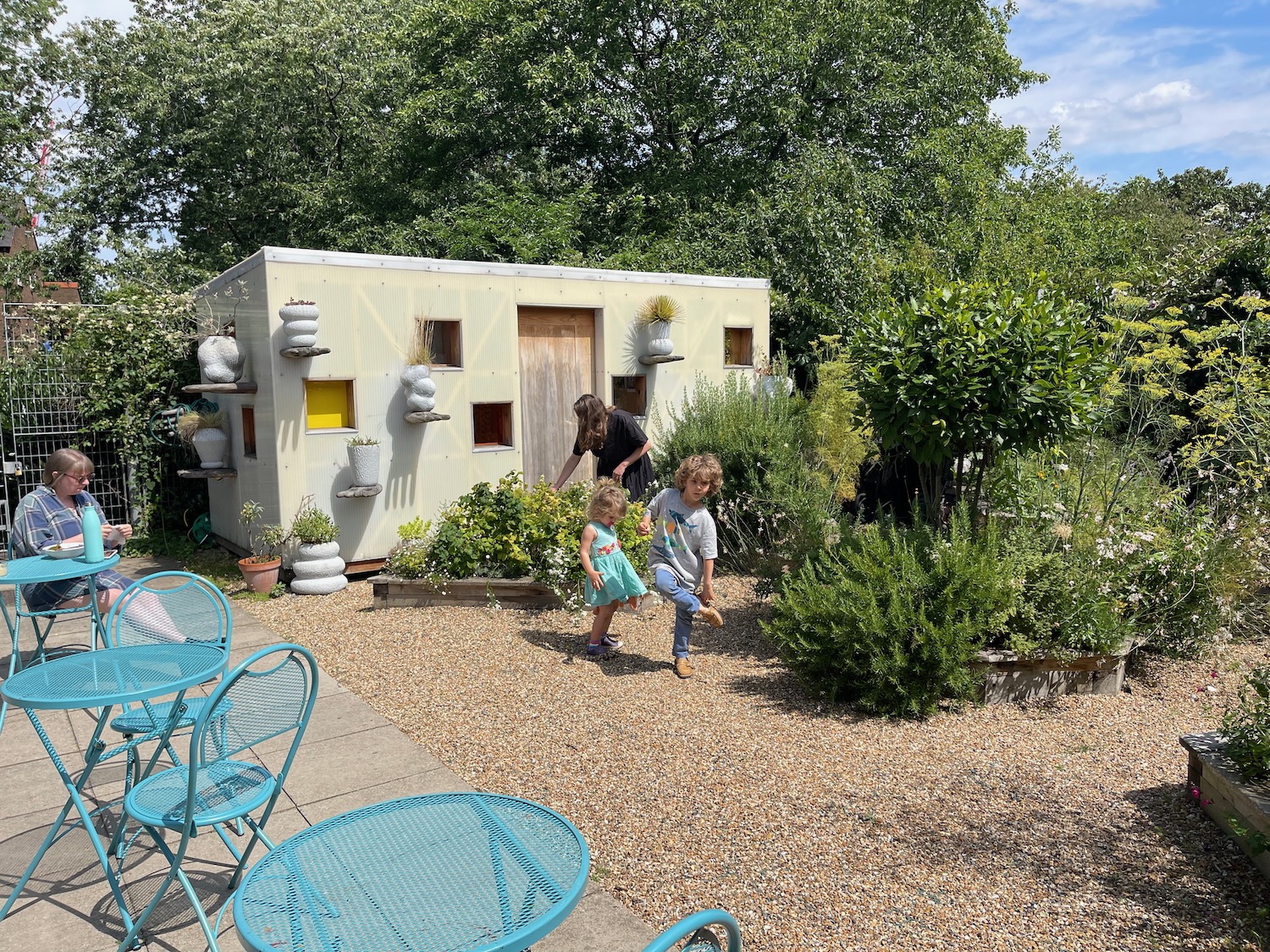 a group of kids playing in a garden