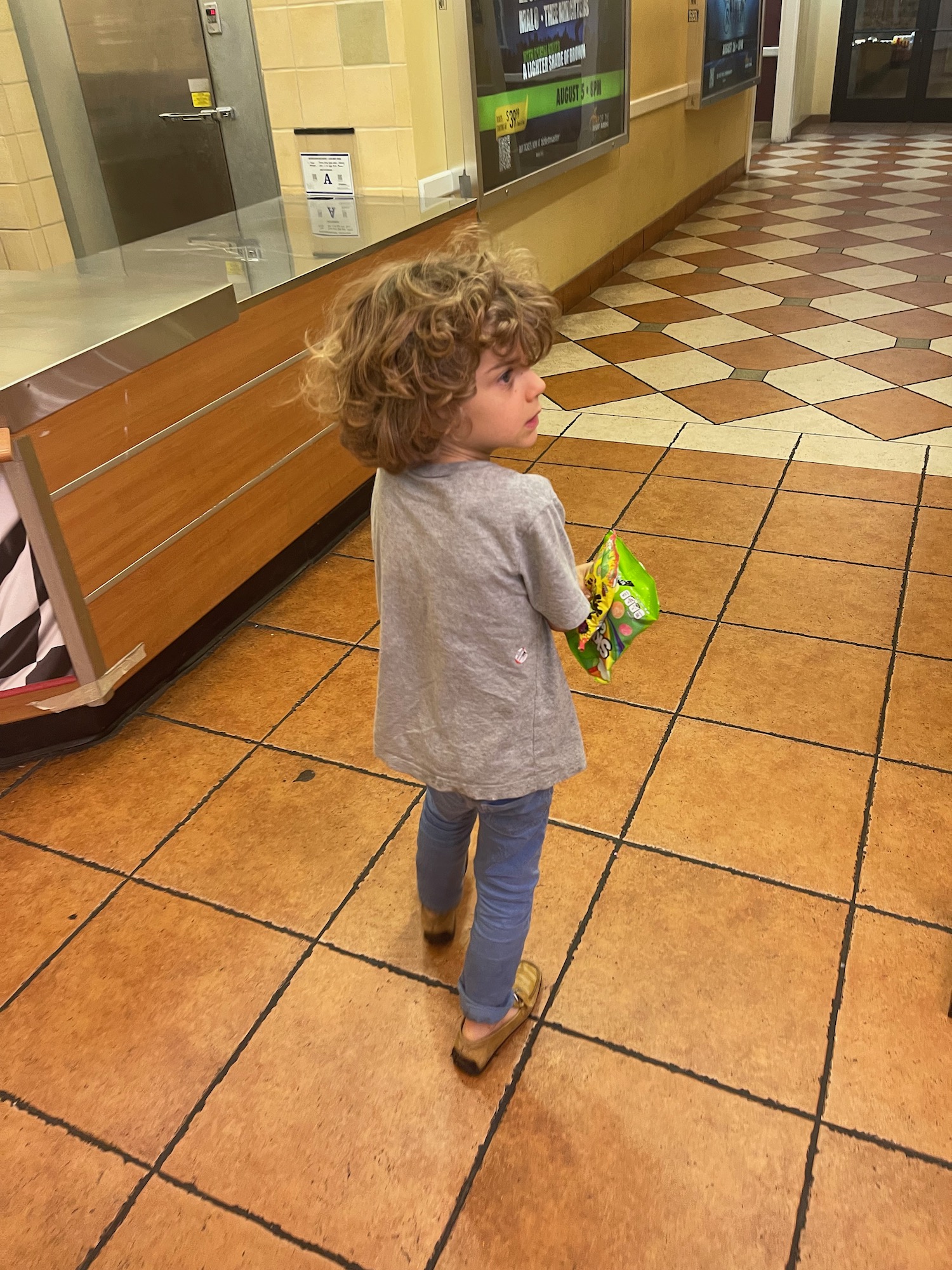 a child standing in a hallway