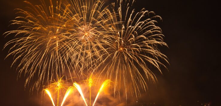 fireworks in the sky over water