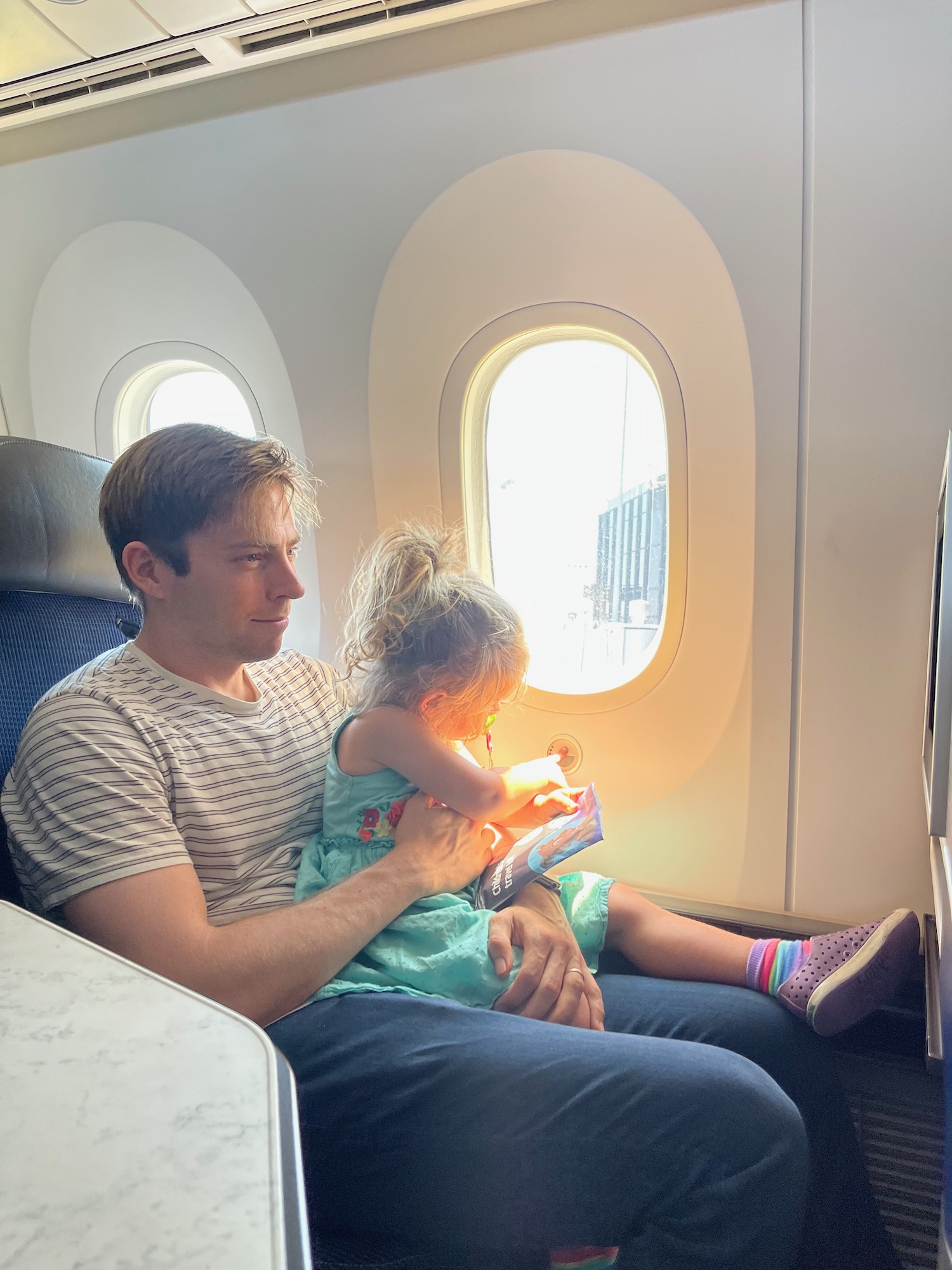 a man and a child on an airplane