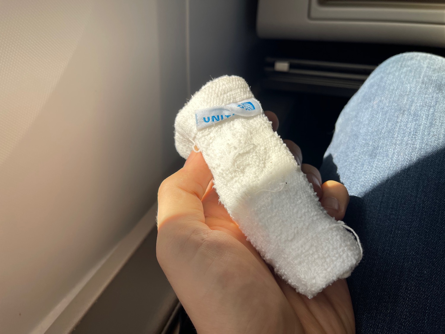 a person holding a small white object