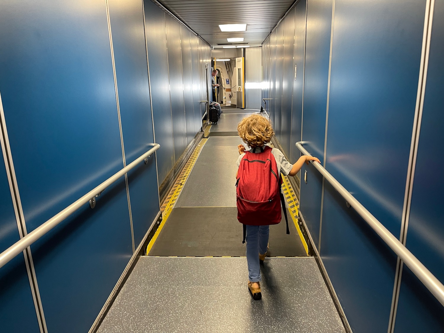 a child walking down a hallway