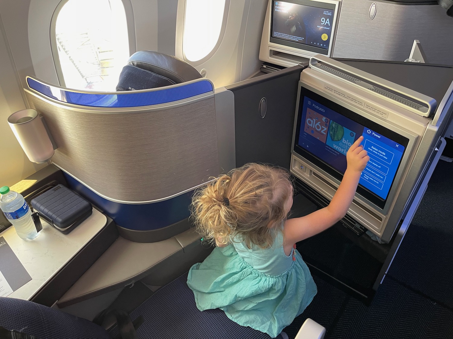 a child sitting in an airplane