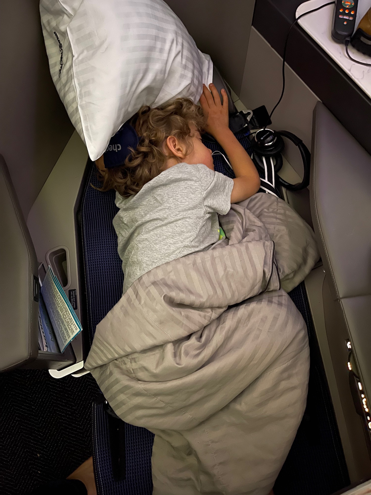 a child sleeping in a plane