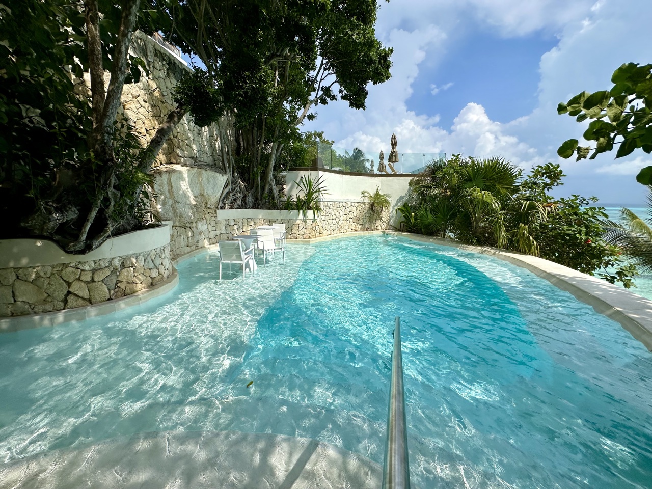 impression by secrets isla mujeres mid level pool and waterfall